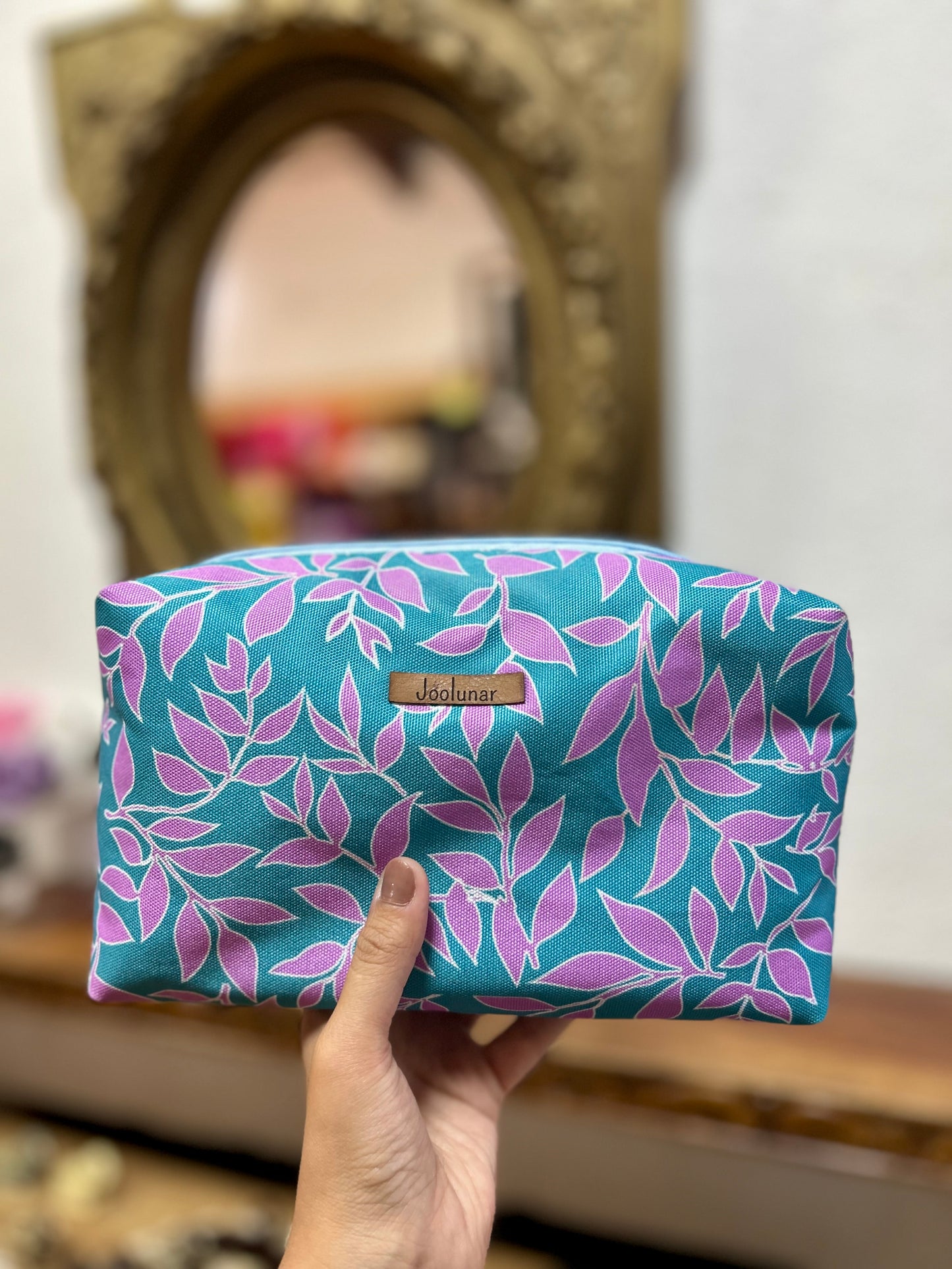 Neceser turquesa hojas